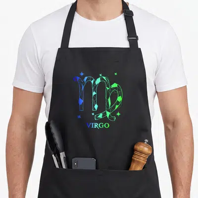 Cute virgo zodiac aprons - Geometric Virgo symbol in blue and green triangles with five stars and centered text — shown on a black cotton canvas apron against a white background