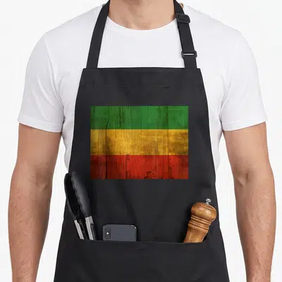 Ethiopian african apron - Distressed Ethiopian flag with green yellow and red horizontal stripes on black fabric — shown on a black cotton canvas apron against a white background