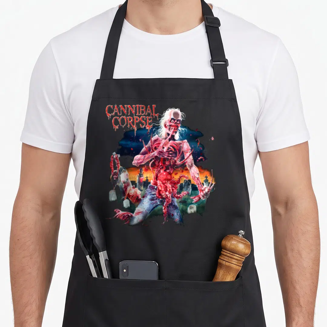 Merchandise cannibal corpse apron - Realistic zombie ripping chest open in graveyard with red CANNIBAL CORPSE text — shown on a black cotton canvas apron against a white background