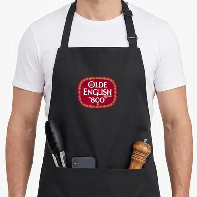 Olde english apron - Red logo with gold border containing white text OLDE ENGLISH BRAND 800 — shown on a black cotton canvas apron against a white background