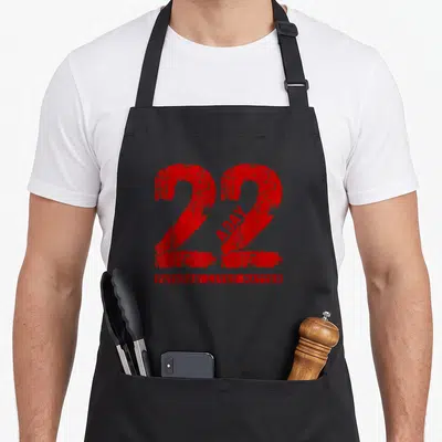 Veteran air force mom apron - Red distressed 22 A Day graphic with VETERAN LIVES MATTER text below — shown on a black cotton canvas apron against a white background