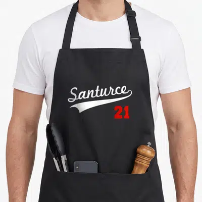 Puerto baseball apron - White Santurce script over white swoosh with red 21 number below — shown on a black cotton canvas apron against a white background