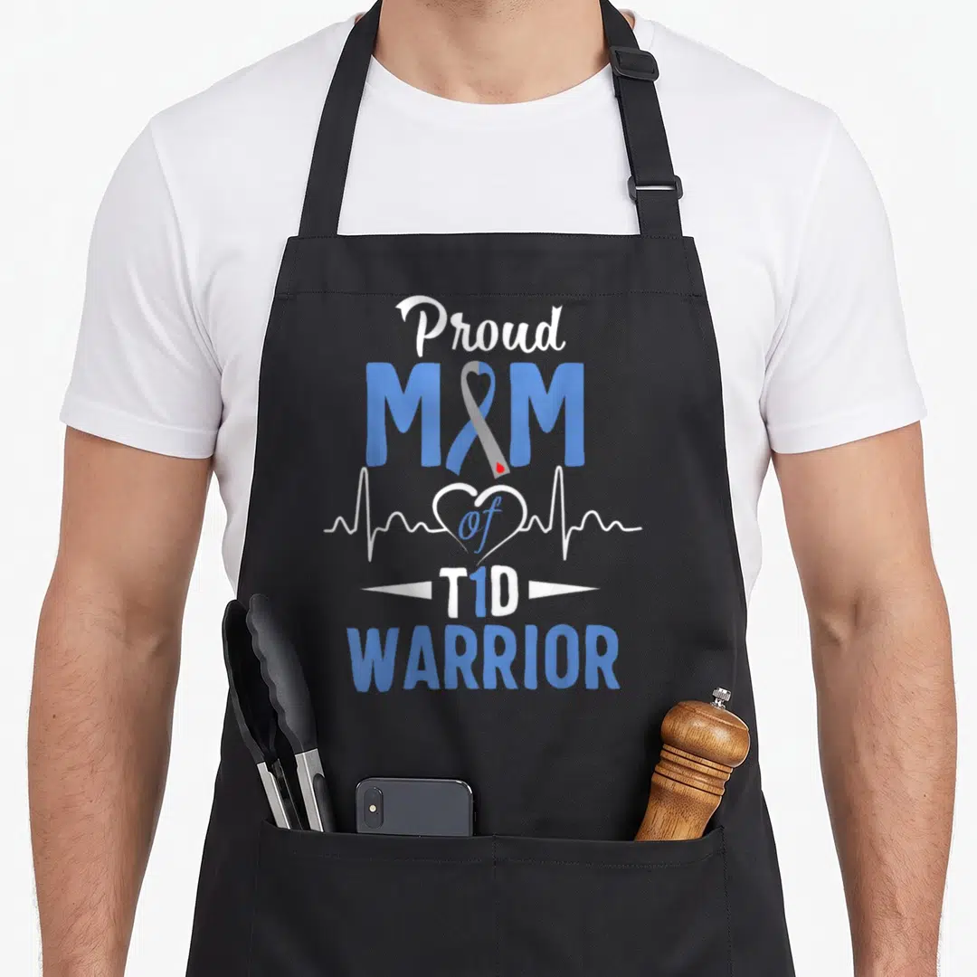 T1d mothers day apron - Proud M M of T1D WARRIOR text with blue ribbon and white heartbeat line on grey background — shown on a black cotton canvas apron against a white background