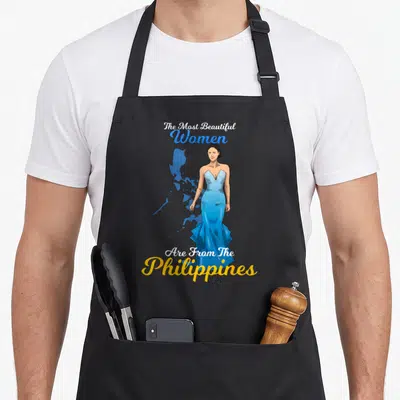 Philippine beautiful apron - Woman in blue dress stands before Philippines map with pride text — shown on a black cotton canvas apron against a white background