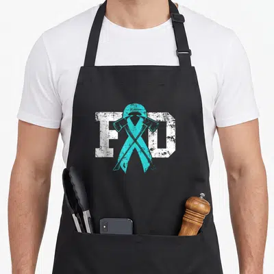Ptsd firefighter apron - Distressed white FD text behind teal awareness ribbon with two crossed fire axes — shown on a black cotton canvas apron against a white background