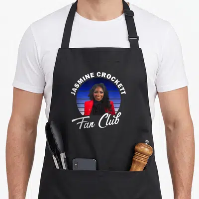 Jasmine texas apron - Jasmine Crockett photo in blue circle with Fan Club text on black apron — shown on a black cotton canvas apron against a white background
