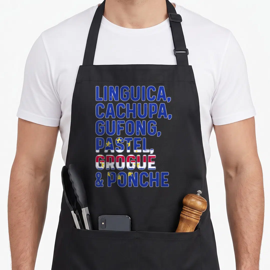 Flag cabo cape verde apron - Stacked text listing Cape Verdean foods Linguica Cachupa Gufong Pastel Grogue Ponche — shown on a black cotton canvas apron against a white background