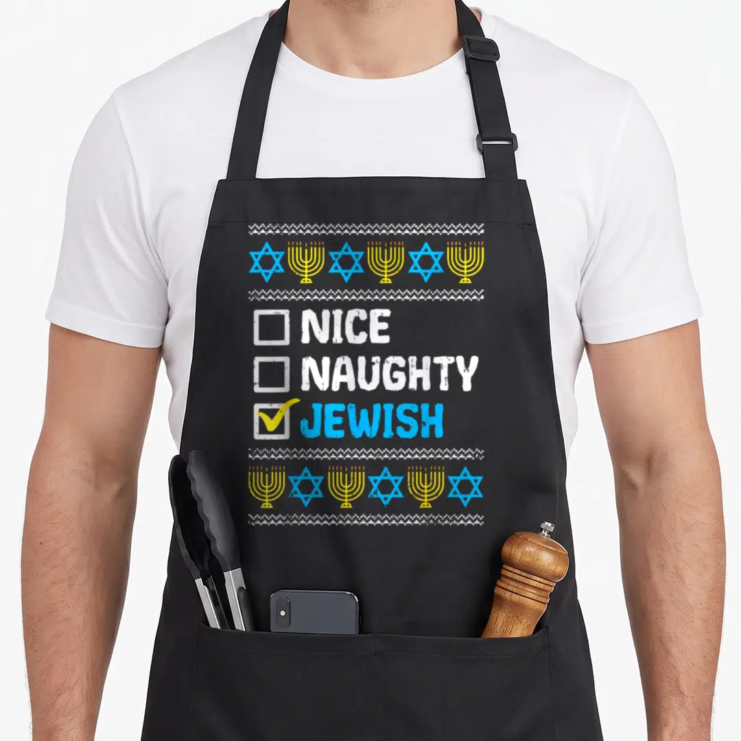 Naughty jewish apron - Checklist with NICE NAUGHTY JEWISH text and blue yellow menorah star borders — shown on a black cotton canvas apron against a white background