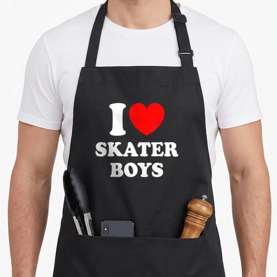 Skater mother's day aprons - White I and red heart next to stacked SKATER BOYS text — shown on a black cotton canvas apron against a white background