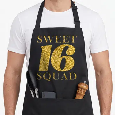 Squad sixteen birthday apron - Gold glitter text reading SWEET 16 SQUAD stacked vertically — shown on a black cotton canvas apron against a white background