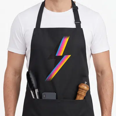 Lightning cute rainbow apron - Stylized black lightning bolt with blue pink and yellow trailing lines — shown on a black cotton canvas apron against a white background
