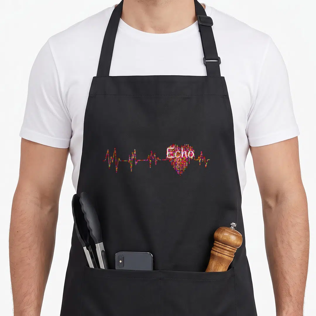 Echo sonographer apron - Multicolored dotted heart with EKG line and Echo text in cartoon style — shown on a black cotton canvas apron against a white background
