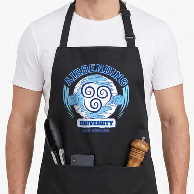 Air nomad apron - Blue and white Airbending University logo with triple swirl emblem and arched typography — shown on a black cotton canvas apron against a white background