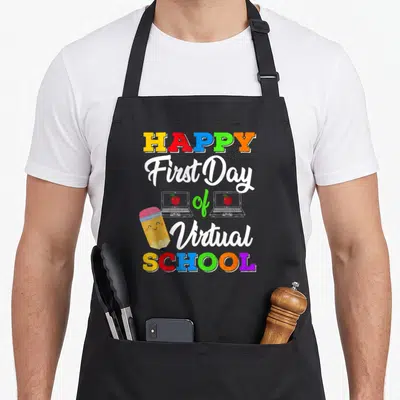 School teaching apron - Stacked happy first day virtual school text with two laptops showing red apples and a smiling — shown on a black cotton canvas apron against a white background