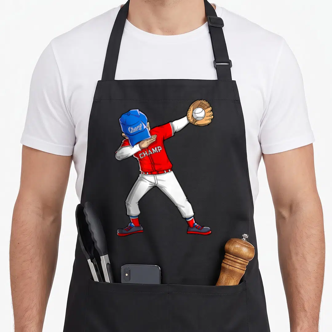 Dabbing player baseball apron - Cartoon baseball player dabbing in red and blue uniform with Champ text on cap — shown on a black cotton canvas apron against a white background