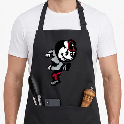 Funny brutus ohio girl apron - Running cartoon mascot in black white grey and red with cap — shown on a black cotton canvas apron against a white background