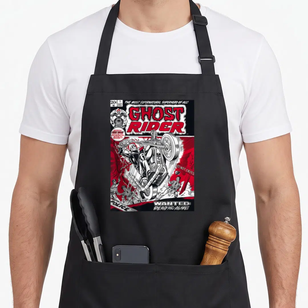 Comic ghost apron - Red and black comic cover showing Ghost Rider on a motorcycle with wanted poster text — shown on a black cotton canvas apron against a white background