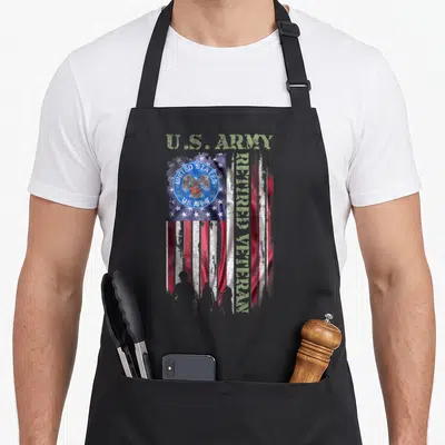 Proud retired american flag apron - Distressed US flag with U.S. ARMY text, circular Army seal, and vertical RETIRED — shown on a black cotton canvas apron against a white background