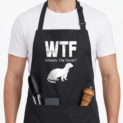Funny ferret lover apron - Distressed white WTF Where's The Ferret text above a ferret silhouette on black fabric — shown on a black cotton canvas apron against a white background