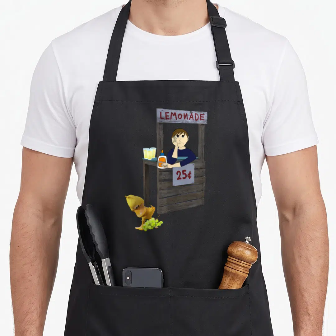 Song grape duck apron - Lemonade stand with glued vendor, yellow duck holding grapes, 25 cent sign — shown on a black cotton canvas apron against a white background