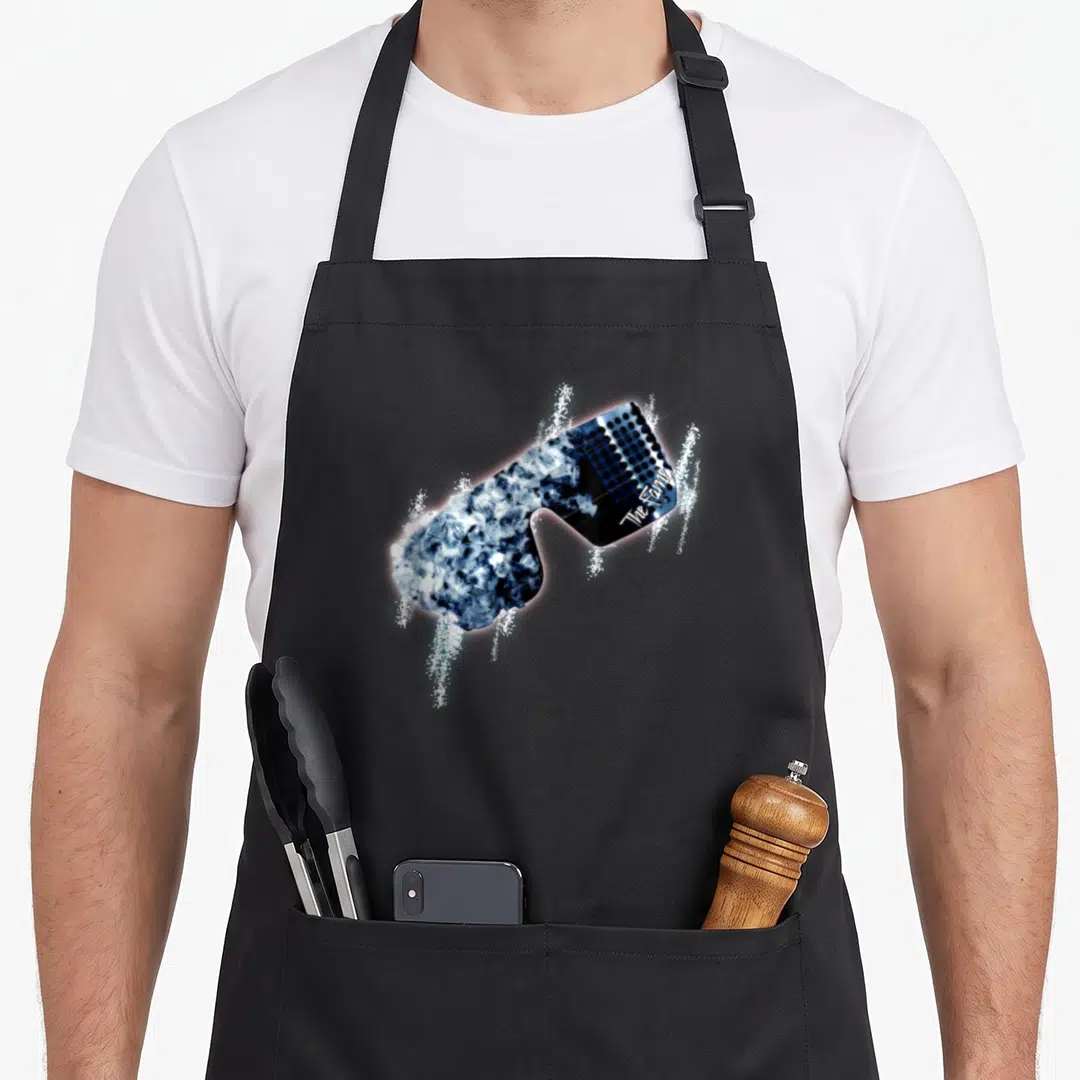 Music glass apron - Sunglasses with ice lenses and The Family text in blue black white — shown on a black cotton canvas apron against a white background
