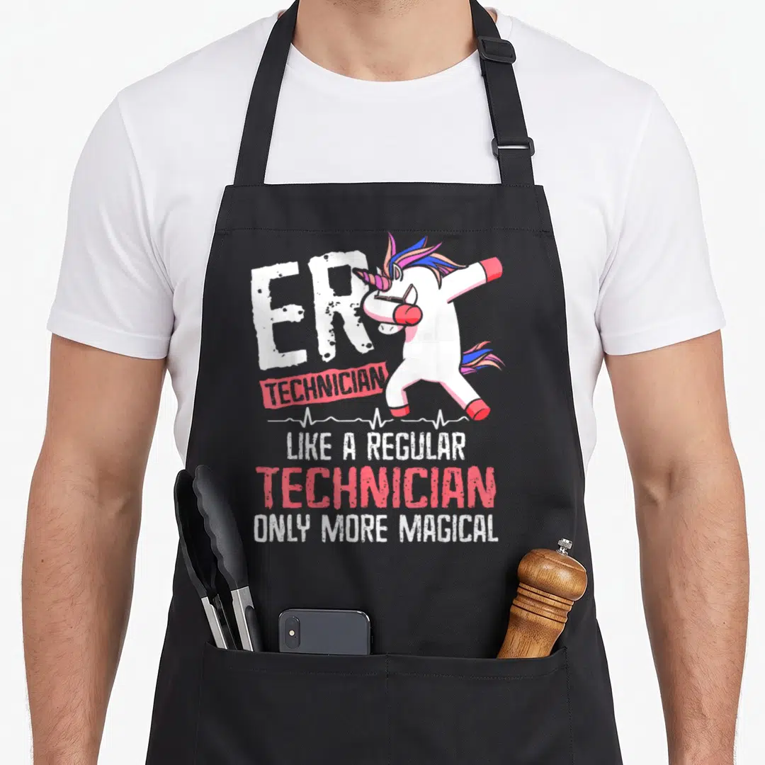 Technician magic apron - Dabbing unicorn with multi-colored mane above heartbeat line and stacked ER TECHNICIAN text — shown on a black cotton canvas apron against a white background