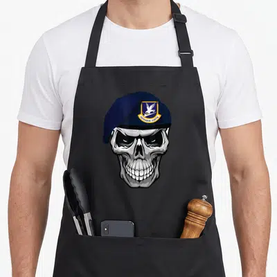 Air skull apron - Grey skull wearing navy beret with shield patch containing eagle and DEFENSOR FORTIS text — shown on a black cotton canvas apron against a white background