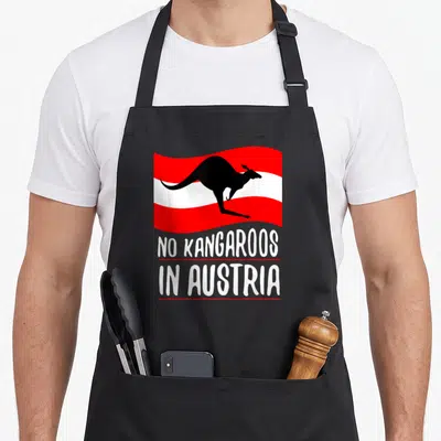 Funny austria kangaroo apron - Black kangaroo silhouette on red and white stripes with stacked white text separated — shown on a black cotton canvas apron against a white background