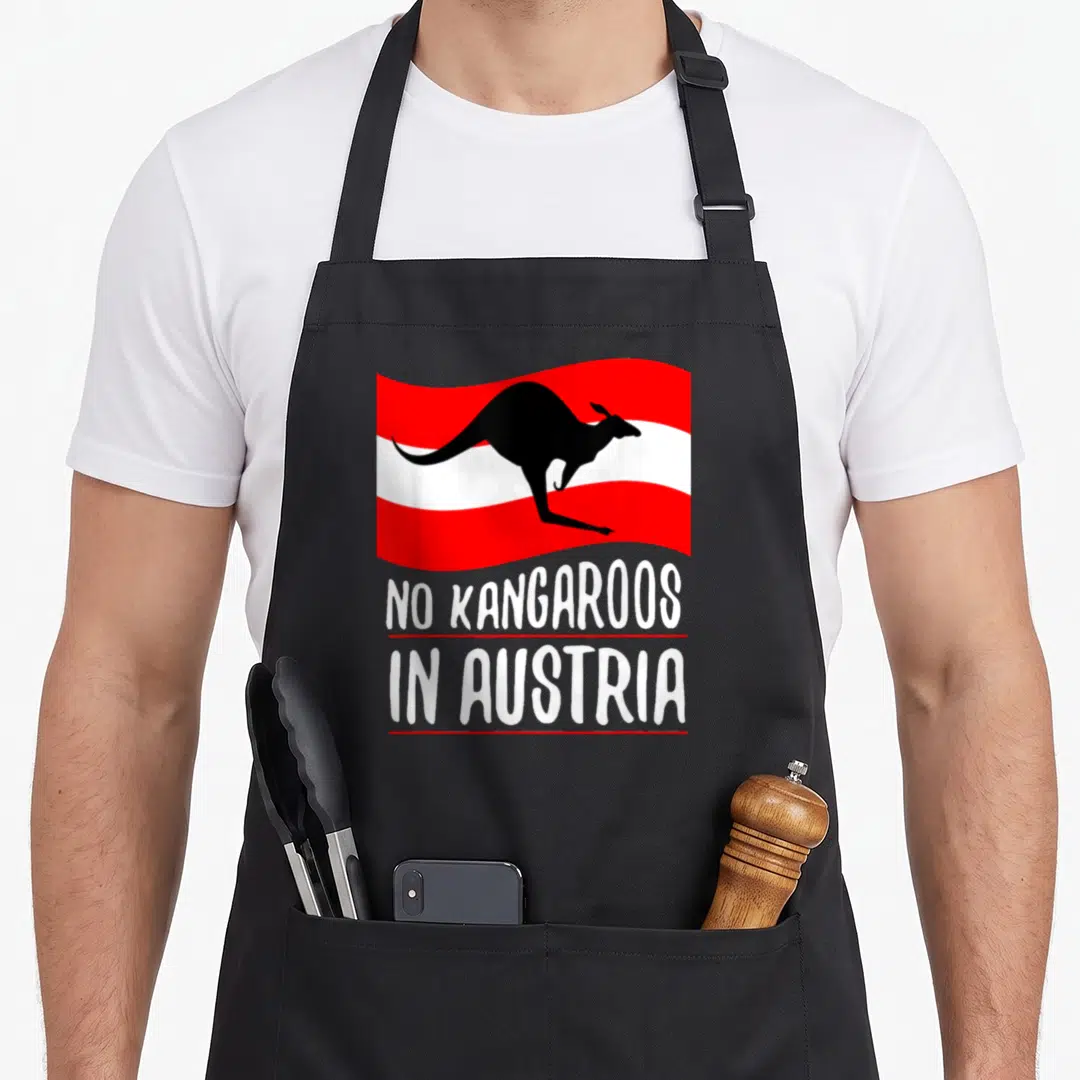 Funny austria kangaroo apron - Black kangaroo silhouette on red and white stripes with stacked white text separated — shown on a black cotton canvas apron against a white background