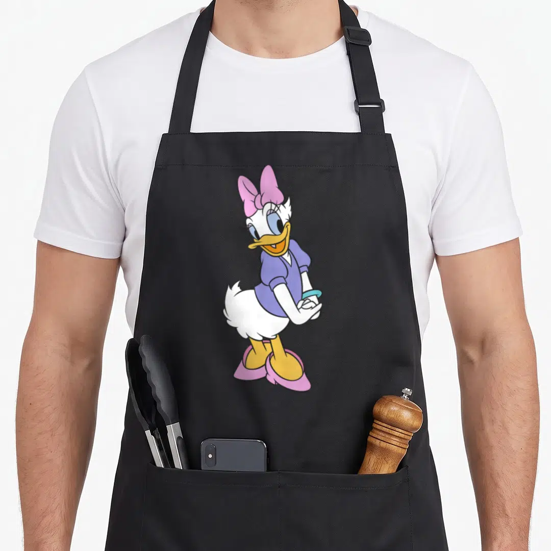 Friend daisy apron - Cartoon Daisy Duck standing with pink bow and purple shirt, no text — shown on a black cotton canvas apron against a white background