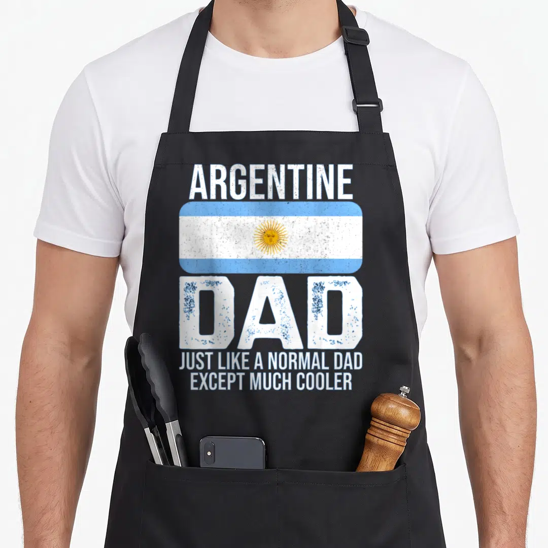 Argentina father day apron - Distressed Argentina flag with white and blue stripes and yellow sun symbol surrounded — shown on a black cotton canvas apron against a white background
