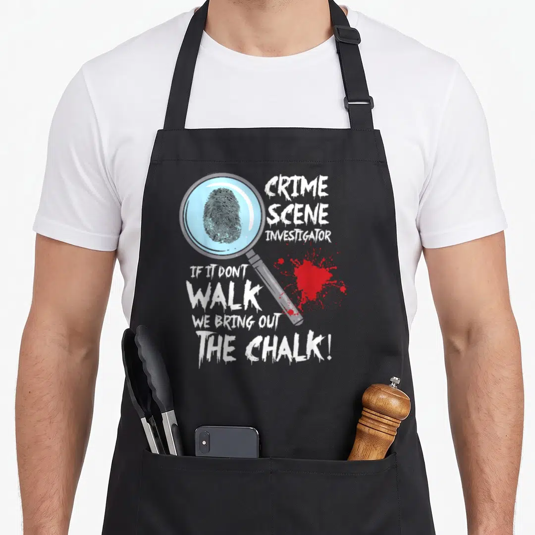 Crime investigator husband apron - Magnifying glass holding a fingerprint next to white text and red blood splatter — shown on a black cotton canvas apron against a white background