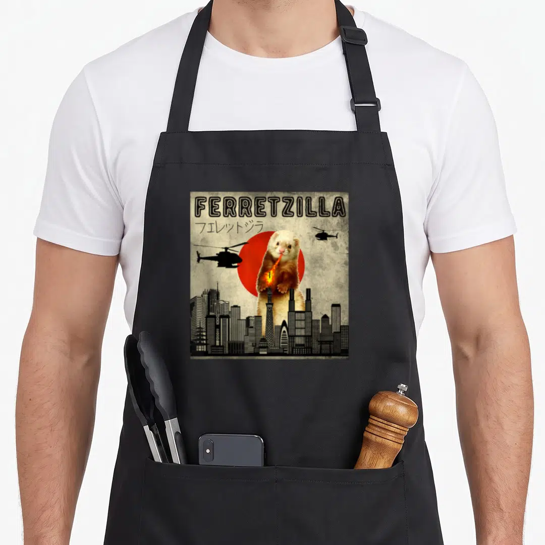 Japanese crazy ferret man apron - Retro illustration of a giant ferret breathing fire over a black city skyline — shown on a black cotton canvas apron against a white background