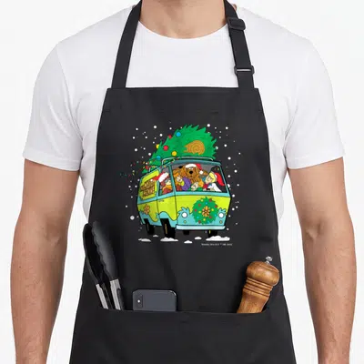 Mystery christmas apron - Mystery Machine van front view with Christmas tree, Santa hats, THE MYSTERY MACHINE text — shown on a black cotton canvas apron against a white background