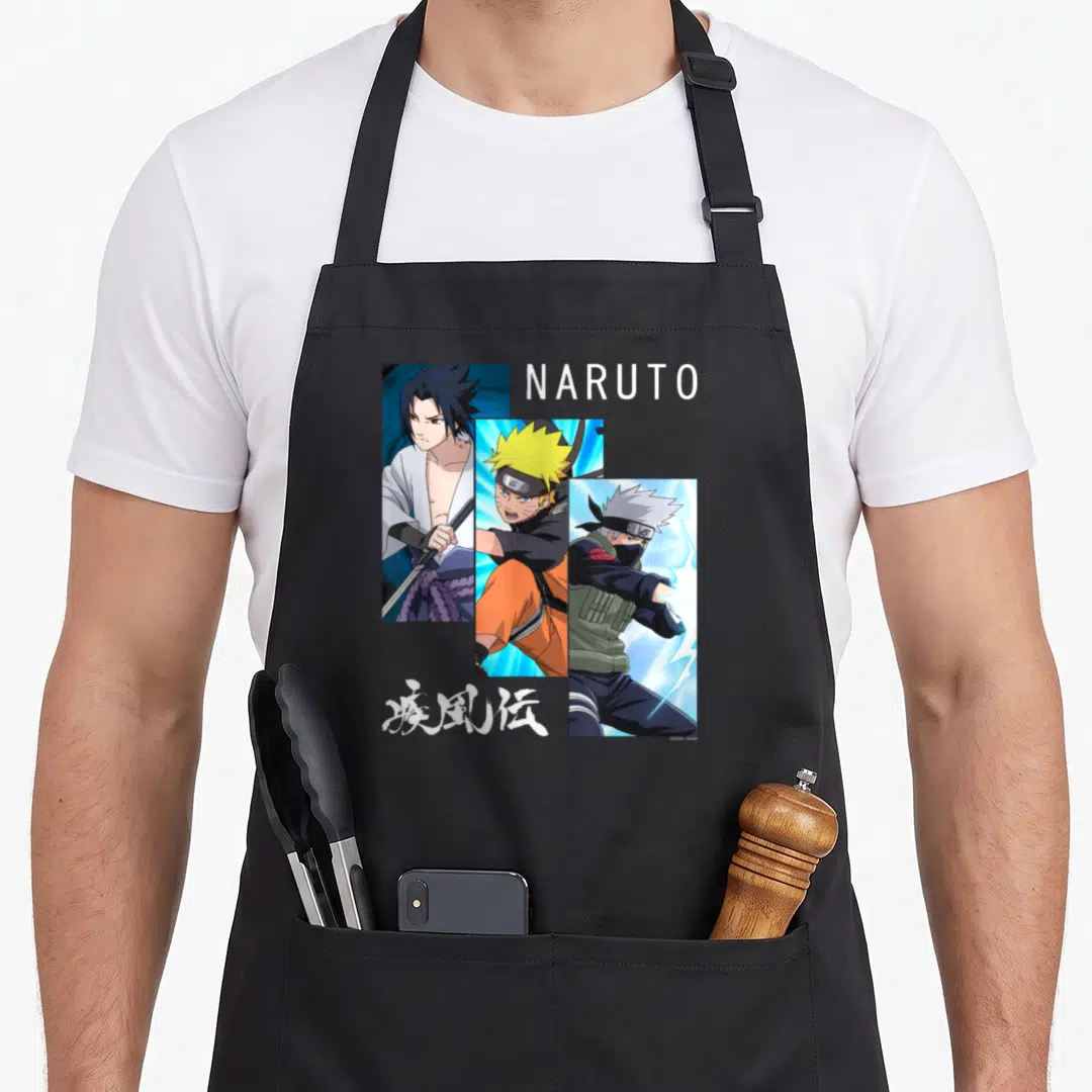 Panel general apron - Three diagonal anime character portraits with NARUTO text and Japanese Kanji in white orange blue — shown on a black cotton canvas apron against a white background