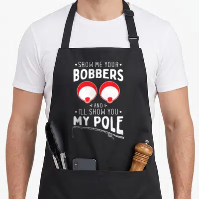 Show fishing aprons - Red and white bobbers with fishing pole and pun text — shown on a black cotton canvas apron against a white background