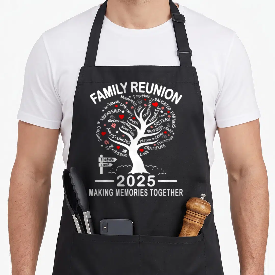 Making memory apron - White family tree with red hearts and text listing family roles like Wife, Brothers, and Cousins — shown on a black cotton canvas apron against a white background