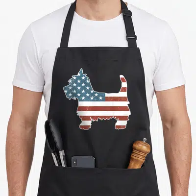 Patriot westie apron - Distressed USA flag pattern filling a standing dog silhouette in red, white, and blue — shown on a black cotton canvas apron against a white background
