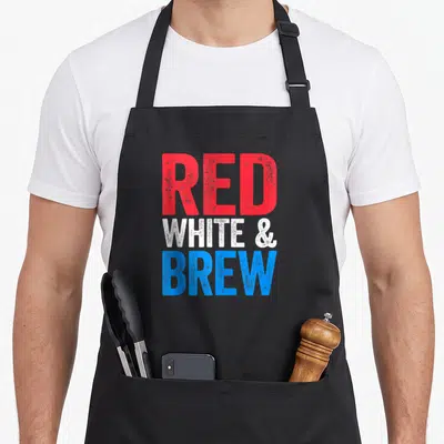 Brew 4th of july apron - Stacked red, white, and blue distressed text reading RED WHITE & BREW — shown on a black cotton canvas apron against a white background