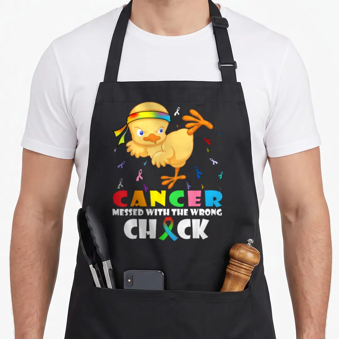 Messed cancer apron - Yellow chick with rainbow headband and stacked text reading Cancer Messed With Wrong Chick — shown on a black cotton canvas apron against a white background