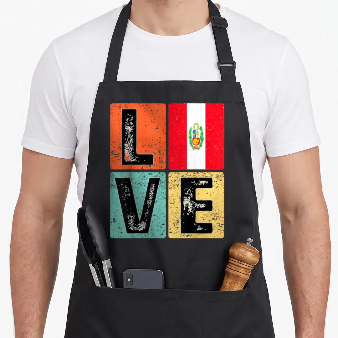 Flag peruvian pride apron - Retro LOVE text in four colored squares with Peruvian flag replacing the letter O — shown on a black cotton canvas apron against a white background