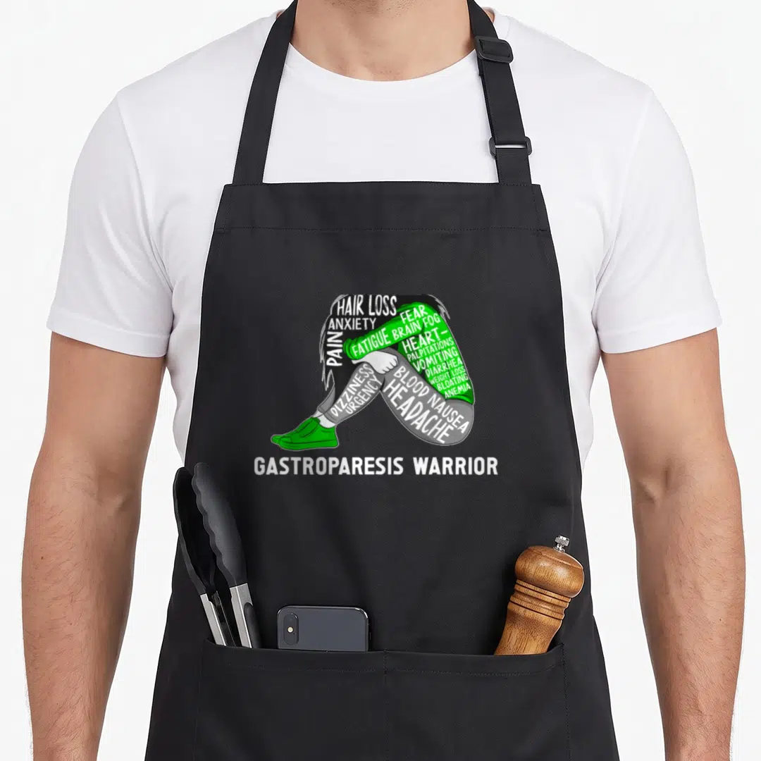 Month gastroparesis awareness apron - Person formed by symptom words Hair Loss Pain Fatigue Brain Fog in green white — shown on a black cotton canvas apron against a white background
