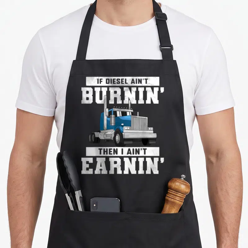 Driver wheeler semi truck apron - Blue cartoon semi-truck centered between white text blocks reading IF DIESEL AIN'T — shown on a black cotton canvas apron against a white background
