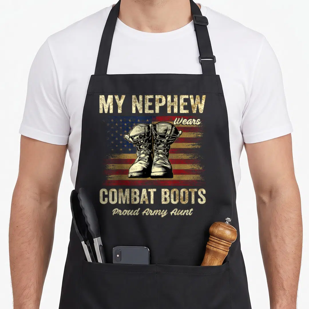 Nephew combat apron - Distressed US flag with pair of combat boots and proud army aunt text — shown on a black cotton canvas apron against a white background