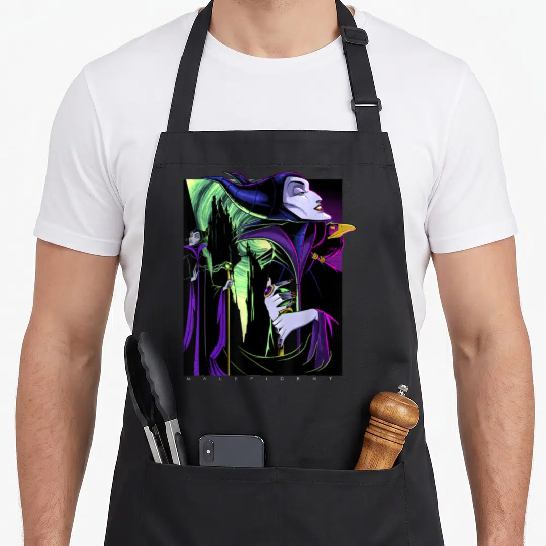 Maleficent portrait beauty apron - Purple Maleficent profile with raven, castle, and MALEFICENT text at bottom — shown on a black cotton canvas apron against a white background