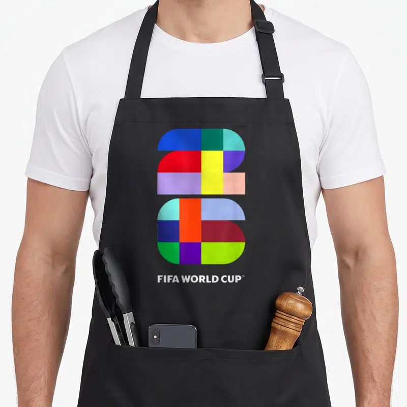 Fifa event apron - Geometric number 26 in blue red yellow green purple with FIFA WORLD CUP text — shown on a black cotton canvas apron against a white background