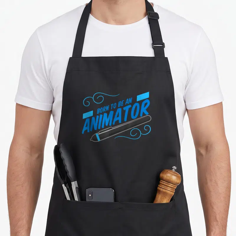 Animation designer apron - Blue Born To Be An Animator text above a diagonal black stylus with swirls — shown on a black cotton canvas apron against a white background