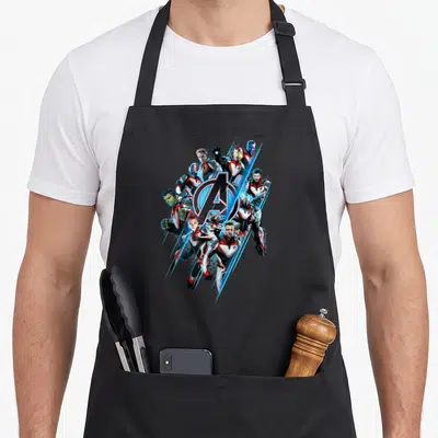 Endgame holiday apron - Avengers characters surrounding A logo with blue diagonal streaks in red white blue and black — shown on a black cotton canvas apron against a white background