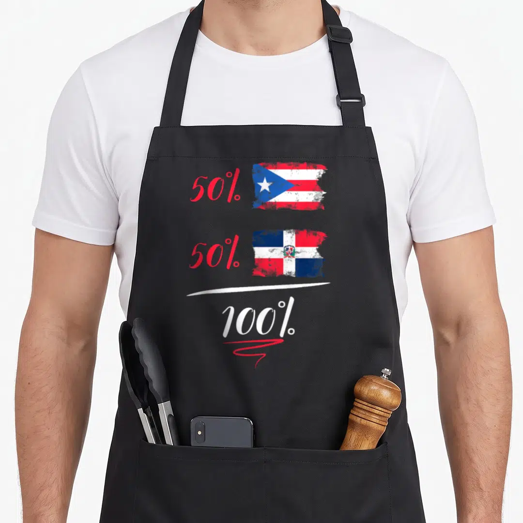 Flag heritage aprons - Two flags next to 50 percent plus 50 percent equals 100 percent text — shown on a black cotton canvas apron against a white background