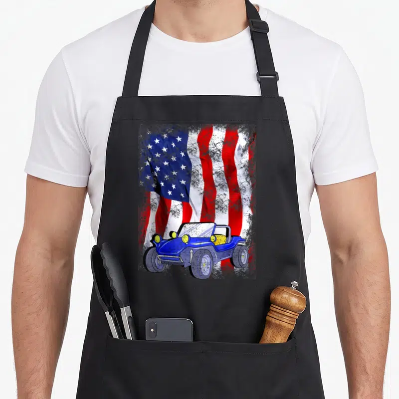Buggy truck apron - Blue dune buggy graphic over a waving distressed American flag in red white and blue — shown on a black cotton canvas apron against a white background